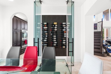 Step onto this stunning contemporary 5B/4Full BA/3 car gar on PGA National Estates Golf Course in Florida - for sale on GolfHomes.com, golf home, golf lot