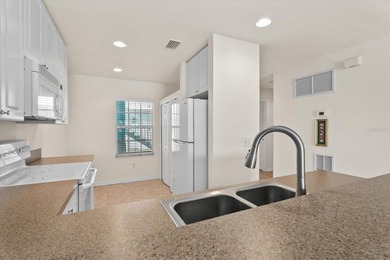 If you want relaxing, tranquil water views and beautiful sunsets on Sabal Trace Golf and Country Club in Florida - for sale on GolfHomes.com, golf home, golf lot