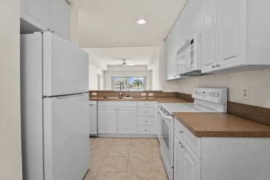 If you want relaxing, tranquil water views and beautiful sunsets on Sabal Trace Golf and Country Club in Florida - for sale on GolfHomes.com, golf home, golf lot