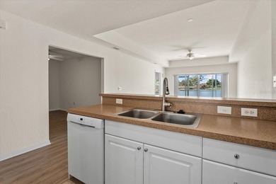 If you want relaxing, tranquil water views and beautiful sunsets on Sabal Trace Golf and Country Club in Florida - for sale on GolfHomes.com, golf home, golf lot