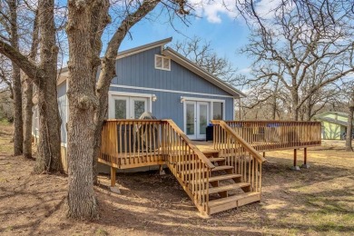 Water view home with waterfront adjacent lot in the master on Nocona Hills Golf Course in Texas - for sale on GolfHomes.com, golf home, golf lot