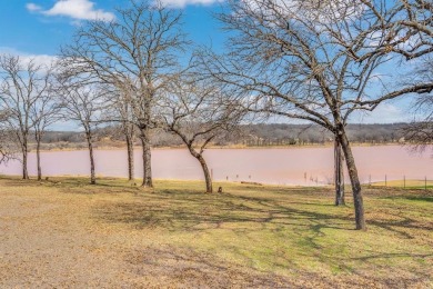 Water view home with waterfront adjacent lot in the master on Nocona Hills Golf Course in Texas - for sale on GolfHomes.com, golf home, golf lot