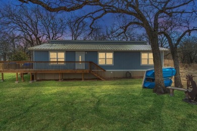 Water view home with waterfront adjacent lot in the master on Nocona Hills Golf Course in Texas - for sale on GolfHomes.com, golf home, golf lot