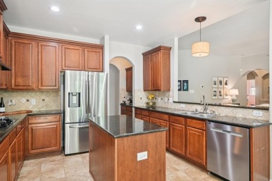 This BEAUTY is nestled on a spacious third-acre lot with a on The Shores Country Club in Texas - for sale on GolfHomes.com, golf home, golf lot