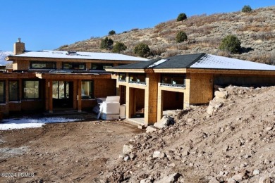 This exceptional new-construction estate, crafted for effortless on Red Ledges Golf Club in Utah - for sale on GolfHomes.com, golf home, golf lot