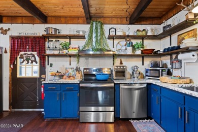 CONTEMPORARY LOG-SIDED CHALET, JUST A MINUTE OR TWO WALK TO THE on The Hideout Golf in Pennsylvania - for sale on GolfHomes.com, golf home, golf lot
