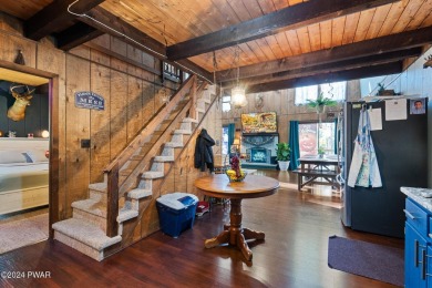 CONTEMPORARY LOG-SIDED CHALET, JUST A MINUTE OR TWO WALK TO THE on The Hideout Golf in Pennsylvania - for sale on GolfHomes.com, golf home, golf lot