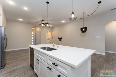 Welcome to this stunning waterfront home in the sought-after SPI on South Padre Island Golf Club in Texas - for sale on GolfHomes.com, golf home, golf lot