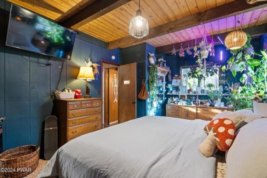 CONTEMPORARY LOG-SIDED CHALET, JUST A MINUTE OR TWO WALK TO THE on The Hideout Golf in Pennsylvania - for sale on GolfHomes.com, golf home, golf lot