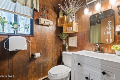 CONTEMPORARY LOG-SIDED CHALET, JUST A MINUTE OR TWO WALK TO THE on The Hideout Golf in Pennsylvania - for sale on GolfHomes.com, golf home, golf lot