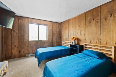 CONTEMPORARY LOG-SIDED CHALET, JUST A MINUTE OR TWO WALK TO THE on The Hideout Golf in Pennsylvania - for sale on GolfHomes.com, golf home, golf lot