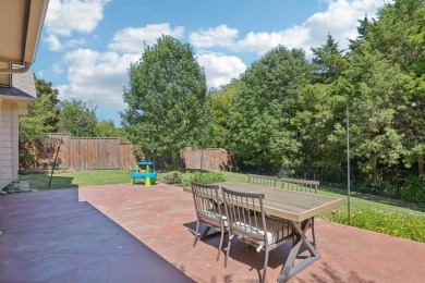 This BEAUTY is nestled on a spacious third-acre lot with a on The Shores Country Club in Texas - for sale on GolfHomes.com, golf home, golf lot