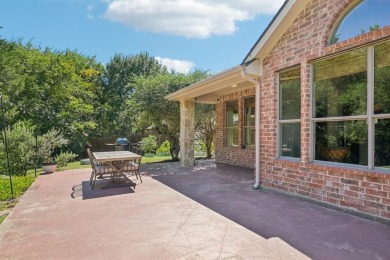 This BEAUTY is nestled on a spacious third-acre lot with a on The Shores Country Club in Texas - for sale on GolfHomes.com, golf home, golf lot