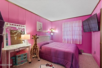 CONTEMPORARY LOG-SIDED CHALET, JUST A MINUTE OR TWO WALK TO THE on The Hideout Golf in Pennsylvania - for sale on GolfHomes.com, golf home, golf lot