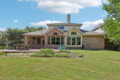 This BEAUTY is nestled on a spacious third-acre lot with a on The Shores Country Club in Texas - for sale on GolfHomes.com, golf home, golf lot