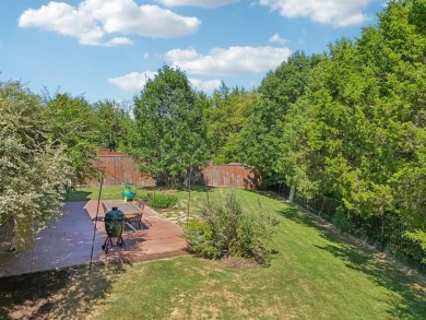 This BEAUTY is nestled on a spacious third-acre lot with a on The Shores Country Club in Texas - for sale on GolfHomes.com, golf home, golf lot