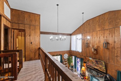CONTEMPORARY LOG-SIDED CHALET, JUST A MINUTE OR TWO WALK TO THE on The Hideout Golf in Pennsylvania - for sale on GolfHomes.com, golf home, golf lot