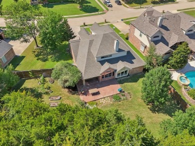 This BEAUTY is nestled on a spacious third-acre lot with a on The Shores Country Club in Texas - for sale on GolfHomes.com, golf home, golf lot