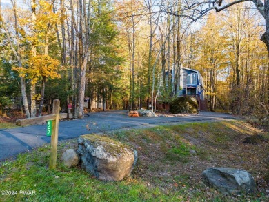 CONTEMPORARY LOG-SIDED CHALET, JUST A MINUTE OR TWO WALK TO THE on The Hideout Golf in Pennsylvania - for sale on GolfHomes.com, golf home, golf lot