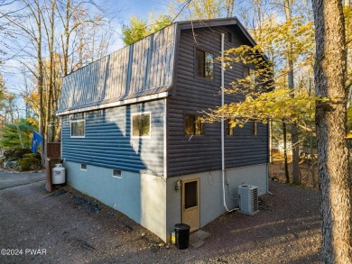CONTEMPORARY LOG-SIDED CHALET, JUST A MINUTE OR TWO WALK TO THE on The Hideout Golf in Pennsylvania - for sale on GolfHomes.com, golf home, golf lot
