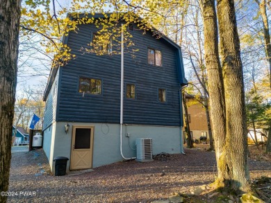 CONTEMPORARY LOG-SIDED CHALET, JUST A MINUTE OR TWO WALK TO THE on The Hideout Golf in Pennsylvania - for sale on GolfHomes.com, golf home, golf lot