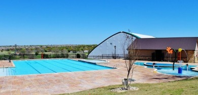 This BEAUTY is nestled on a spacious third-acre lot with a on The Shores Country Club in Texas - for sale on GolfHomes.com, golf home, golf lot