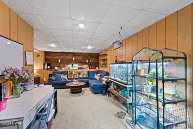 CONTEMPORARY LOG-SIDED CHALET, JUST A MINUTE OR TWO WALK TO THE on The Hideout Golf in Pennsylvania - for sale on GolfHomes.com, golf home, golf lot