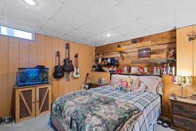 CONTEMPORARY LOG-SIDED CHALET, JUST A MINUTE OR TWO WALK TO THE on The Hideout Golf in Pennsylvania - for sale on GolfHomes.com, golf home, golf lot