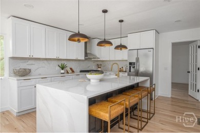 Flooded with natural light, this stunning Scandinavian-inspired on The Landings Club - Plantation in Georgia - for sale on GolfHomes.com, golf home, golf lot