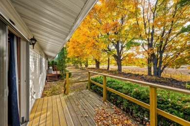 This first-floor unit offers a large living room with vaulted on Bay Ridge Golf Course in Wisconsin - for sale on GolfHomes.com, golf home, golf lot