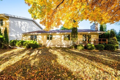 This first-floor unit offers a large living room with vaulted on Bay Ridge Golf Course in Wisconsin - for sale on GolfHomes.com, golf home, golf lot