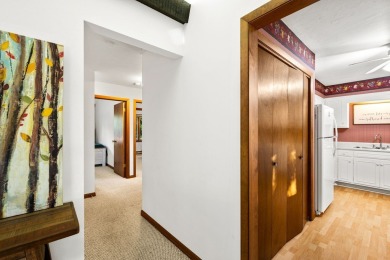 This first-floor unit offers a large living room with vaulted on Bay Ridge Golf Course in Wisconsin - for sale on GolfHomes.com, golf home, golf lot