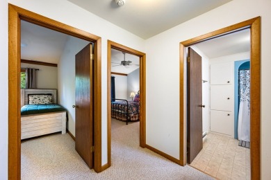 This first-floor unit offers a large living room with vaulted on Bay Ridge Golf Course in Wisconsin - for sale on GolfHomes.com, golf home, golf lot