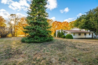 This first-floor unit offers a large living room with vaulted on Bay Ridge Golf Course in Wisconsin - for sale on GolfHomes.com, golf home, golf lot