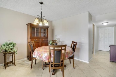 Sun-splashed and move-in ready, this airy second-floor residence on Fountains Golf and Country Club in Florida - for sale on GolfHomes.com, golf home, golf lot