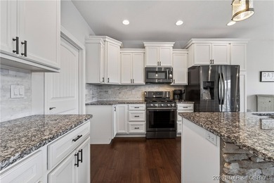 Set along the gorgeous shoreline of Lake of the Ozarks, this on Bayview Golf Course in Missouri - for sale on GolfHomes.com, golf home, golf lot