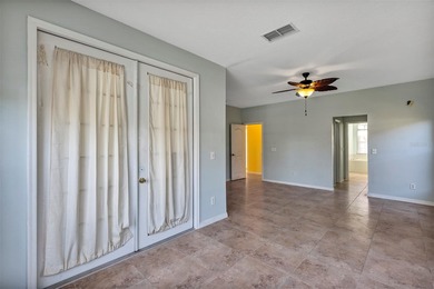 Opportunity to own this 4-bedroom, 3 bath pool home in on Wedgefield Golf Club in Florida - for sale on GolfHomes.com, golf home, golf lot