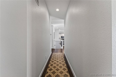 Set along the gorgeous shoreline of Lake of the Ozarks, this on Bayview Golf Course in Missouri - for sale on GolfHomes.com, golf home, golf lot