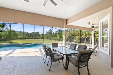 Your dream oasis awaits in this 5BR/3.5BA custom home with on Wedgefield Golf Club in Florida - for sale on GolfHomes.com, golf home, golf lot