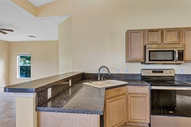 Opportunity to own this 4-bedroom, 3 bath pool home in on Wedgefield Golf Club in Florida - for sale on GolfHomes.com, golf home, golf lot