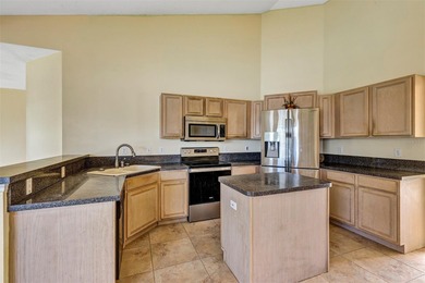 Opportunity to own this 4-bedroom, 3 bath pool home in on Wedgefield Golf Club in Florida - for sale on GolfHomes.com, golf home, golf lot