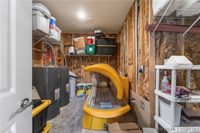 Set along the gorgeous shoreline of Lake of the Ozarks, this on Bayview Golf Course in Missouri - for sale on GolfHomes.com, golf home, golf lot