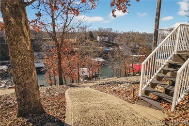 Set along the gorgeous shoreline of Lake of the Ozarks, this on Bayview Golf Course in Missouri - for sale on GolfHomes.com, golf home, golf lot