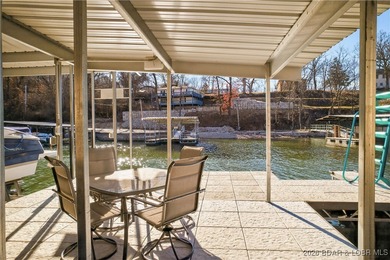 Set along the gorgeous shoreline of Lake of the Ozarks, this on Bayview Golf Course in Missouri - for sale on GolfHomes.com, golf home, golf lot