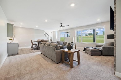 This 2024 Parade of Homes by Hodge Construction overlooks the on Saddleback Ridge Golf Course in Iowa - for sale on GolfHomes.com, golf home, golf lot