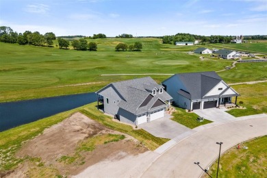 This 2024 Parade of Homes by Hodge Construction overlooks the on Saddleback Ridge Golf Course in Iowa - for sale on GolfHomes.com, golf home, golf lot