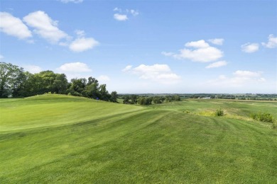 This 2024 Parade of Homes by Hodge Construction overlooks the on Saddleback Ridge Golf Course in Iowa - for sale on GolfHomes.com, golf home, golf lot