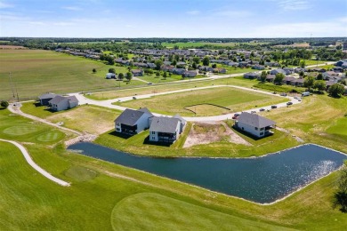 This 2024 Parade of Homes by Hodge Construction overlooks the on Saddleback Ridge Golf Course in Iowa - for sale on GolfHomes.com, golf home, golf lot