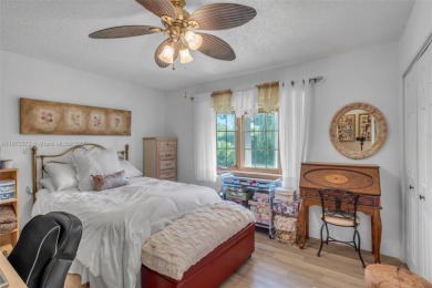 This charming 3-bed/2.5-bath home with a screened-in pool has a on Bonaventure Country Club in Florida - for sale on GolfHomes.com, golf home, golf lot