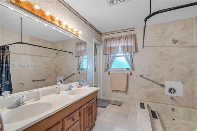 This charming 3-bed/2.5-bath home with a screened-in pool has a on Bonaventure Country Club in Florida - for sale on GolfHomes.com, golf home, golf lot